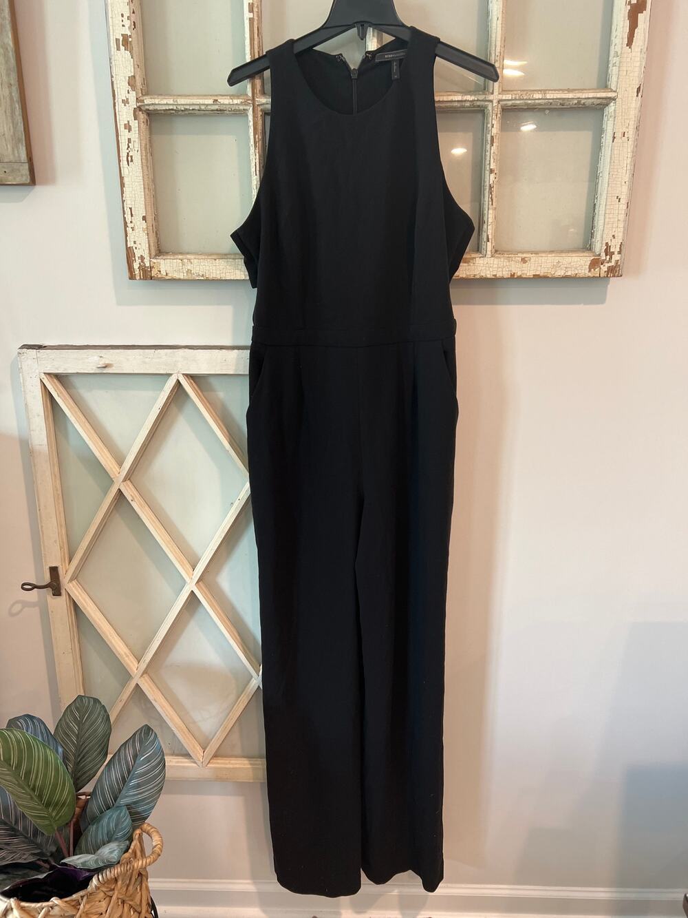 BCBGMaxazria size 12 black jumpsuit cut out sides